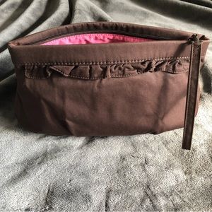 Gap Brown ruffle clutch with hot pink lining.